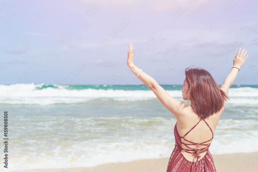 Chinese woman or tourist from asia with happy and relax time on the tropical beach at Karon, Phuket, Thailand Chinese woman or tourist from asia with happy and relax time on the tropical beach at Karon, Phuket, Thailand