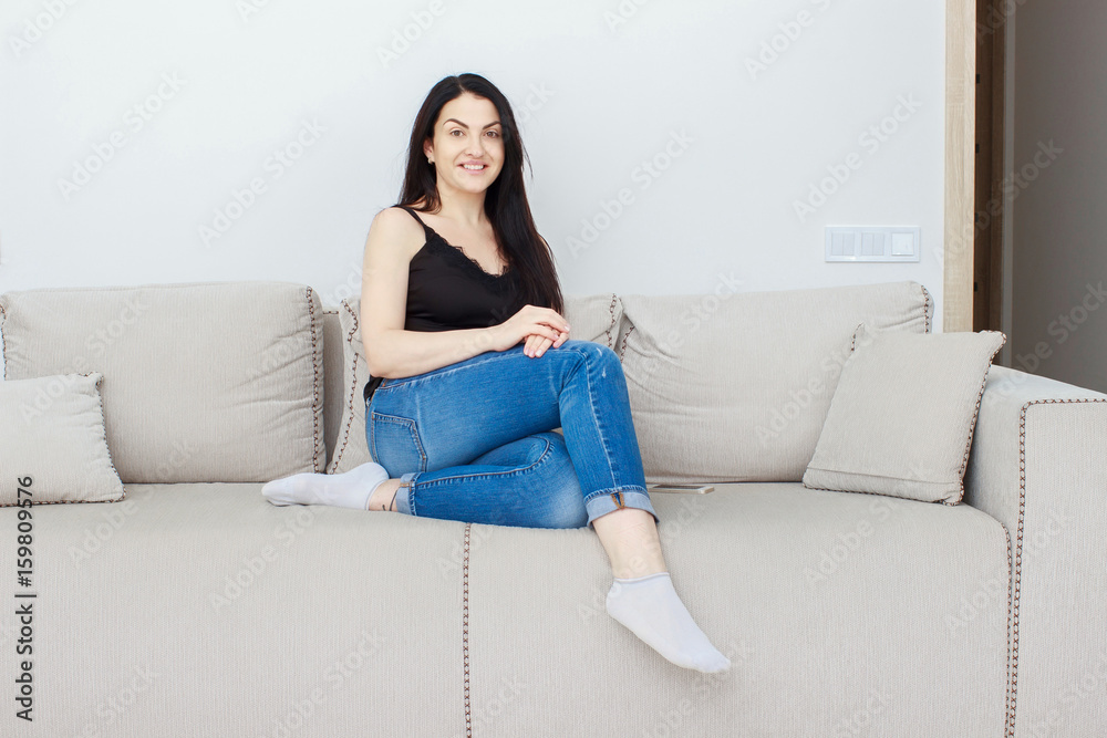 Portrait of beautiful brunette mature woman relaxing at home