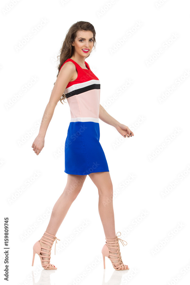 Smiling Walking Woman In Mini Dress And High Heels Smiling Walking Woman In Mini Dress And High Heels