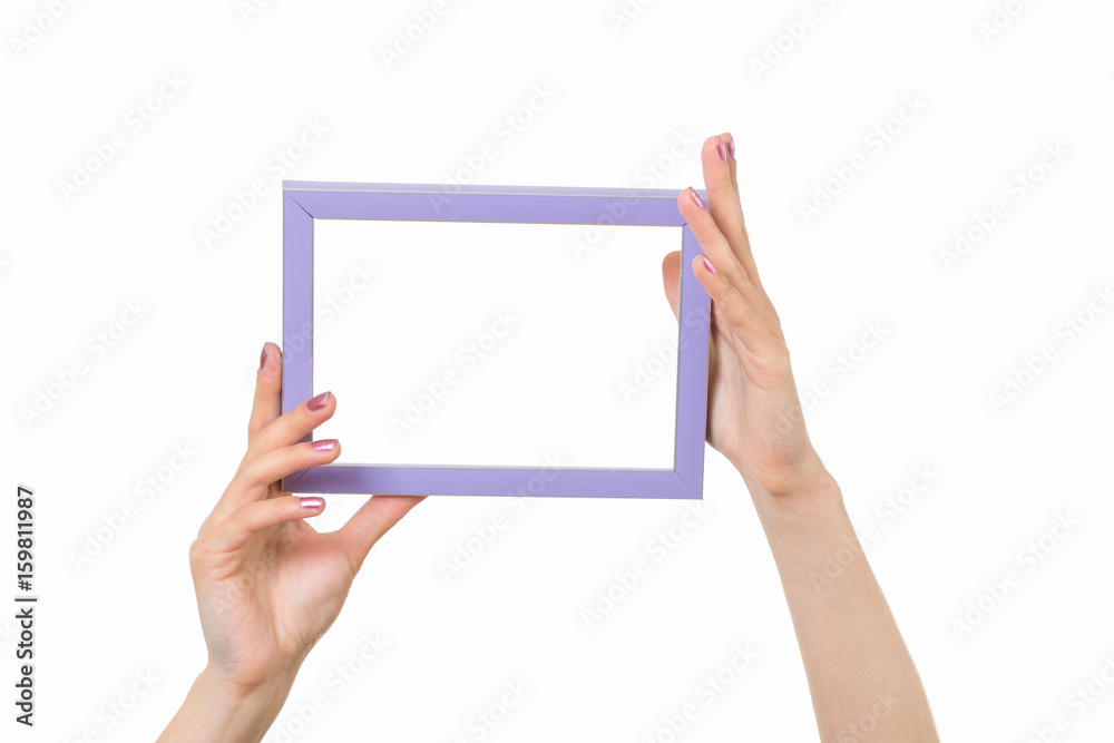 Frame in female hands on a white background Frame in female hands on a white background