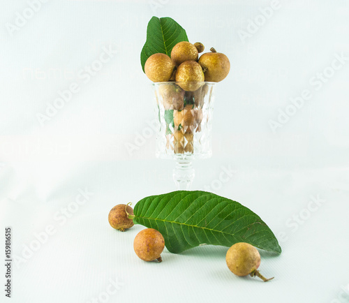 fruit or literally translated as Cat Eye Fruit , a subspecies of the Longan Fruit over white background. photo