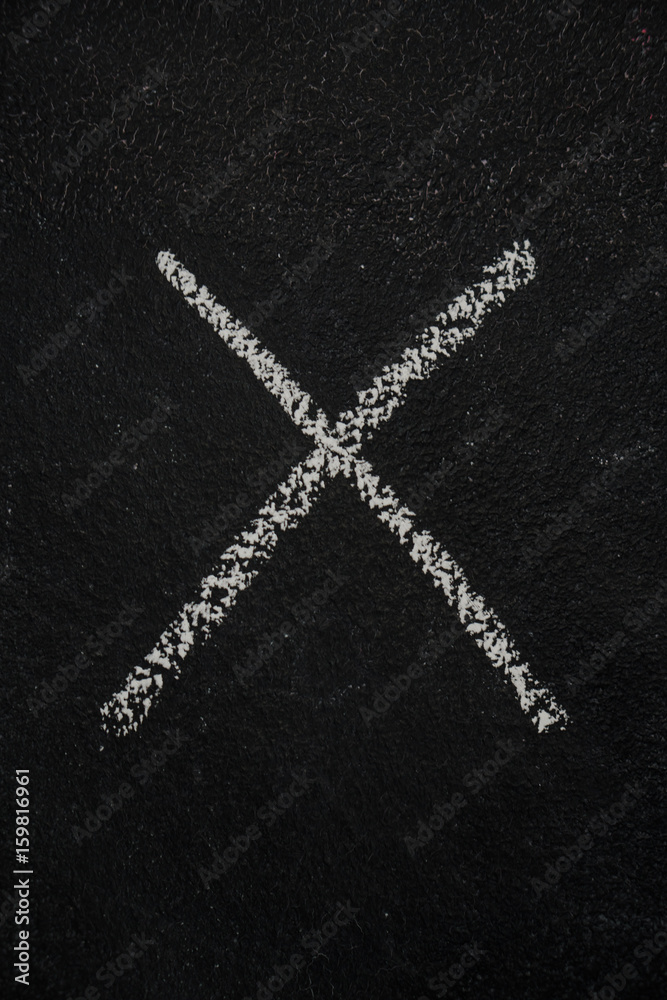 Letter X drawn with white chalk on blackboard. Education, school concept