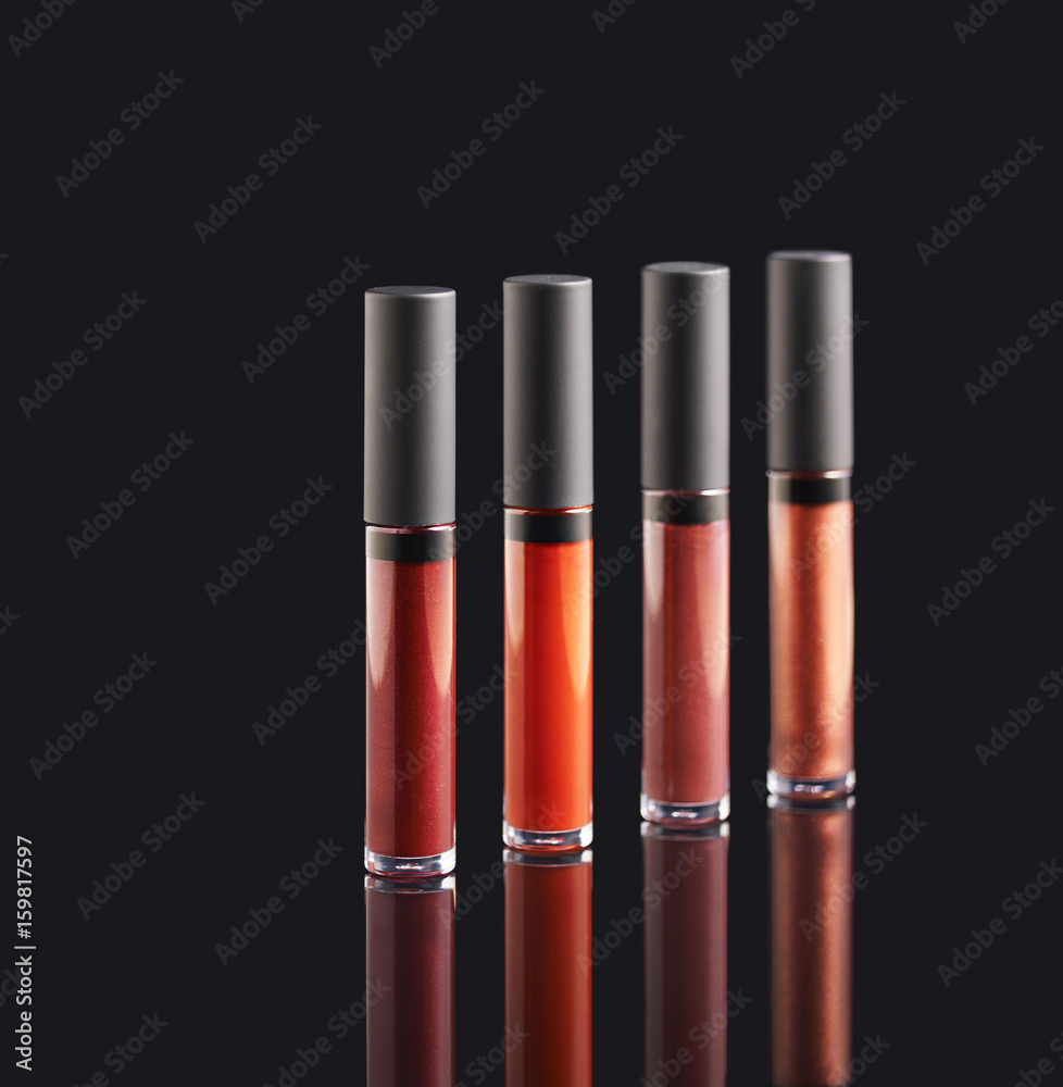 Obraz premium Palette of liquid lipstick on black background