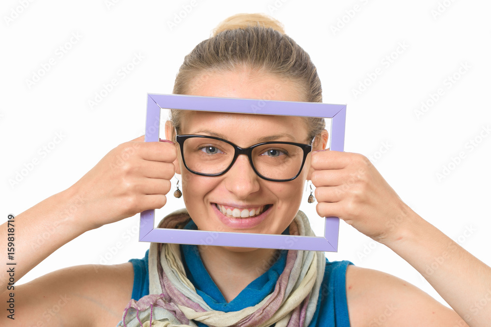 Beautiful girl in a picture frame on a white background.