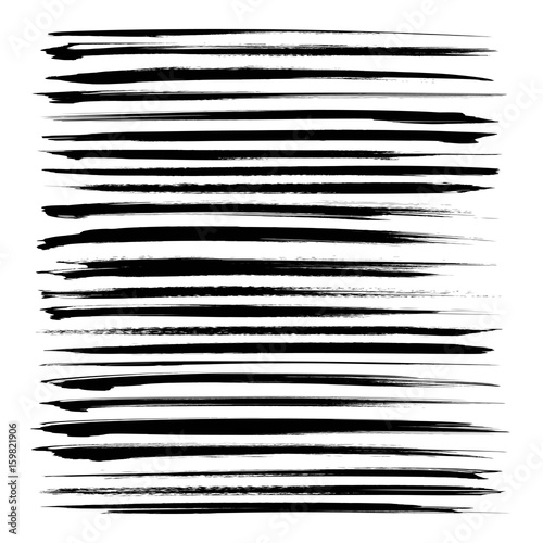 Set of long black textured abstract strokes isolated on a white background