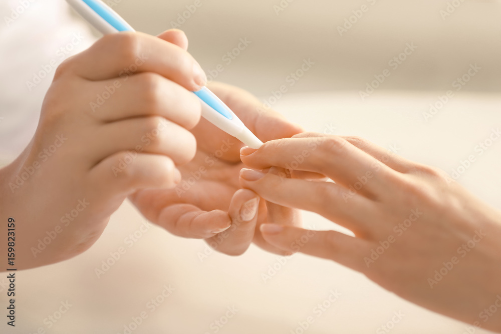 Woman making manicure in salon Woman making manicure in salon