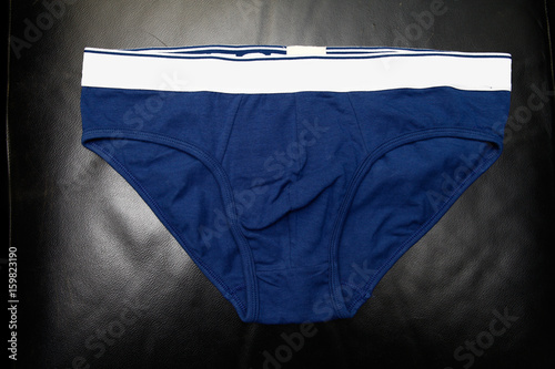 blue underpants for men on black background, isolated