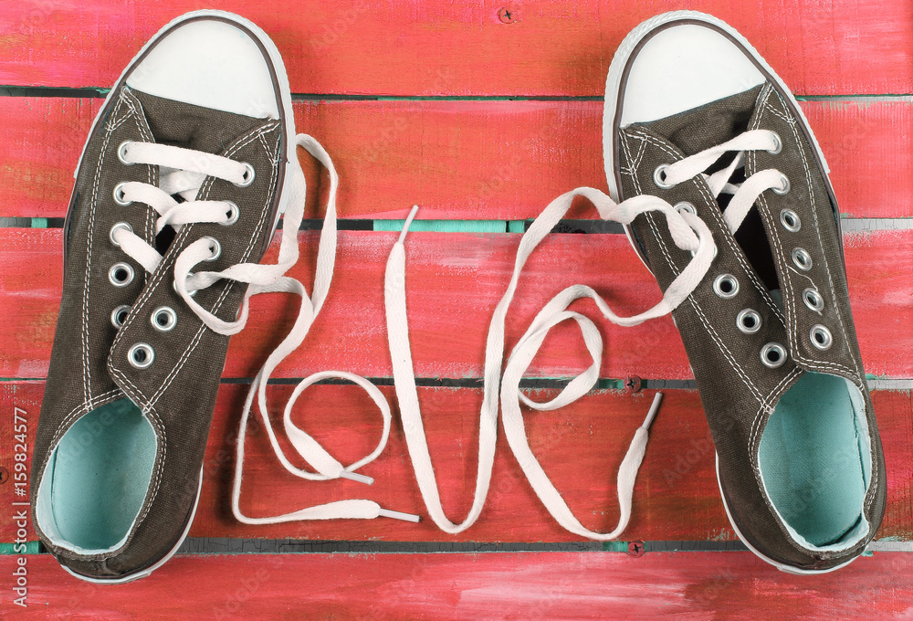 кеды обувь на ярком фоне и любовь Stock Photo | Adobe Stock
