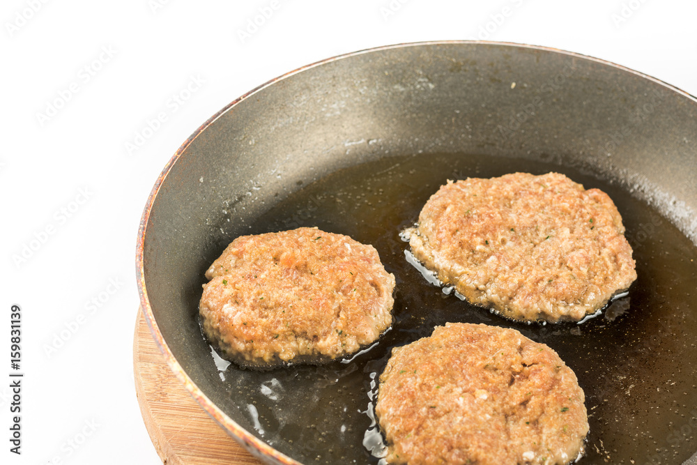 Frying meatballs of minced meat in the frying pan on the oil Frying meatballs of minced meat in the frying pan on the oil