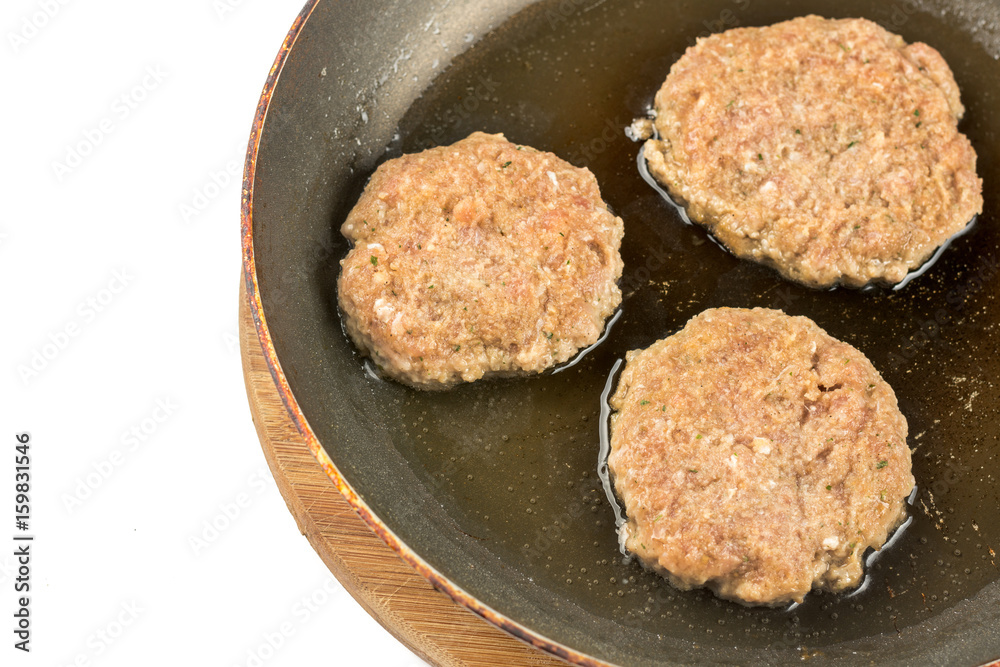 Frying meatballs of minced meat in the frying pan on the oil Frying meatballs of minced meat in the frying pan on the oil