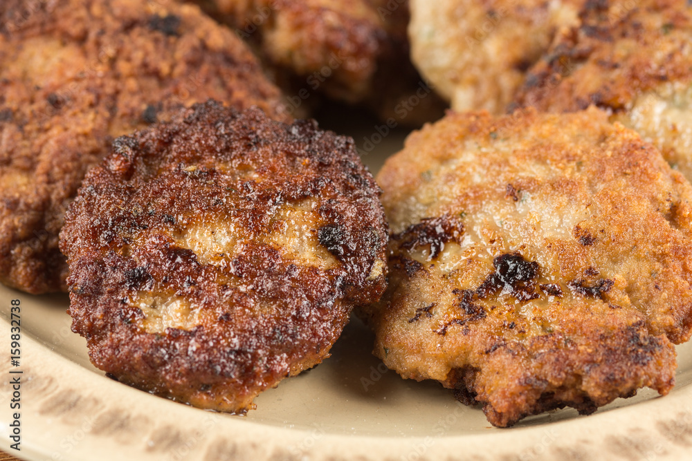 Fried meatballs served on the table isolated over white background Fried meatballs served on the table isolated over white background