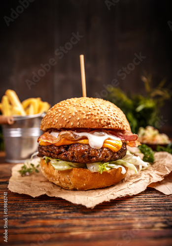 Fototapeta Delicious hamburger with cheese