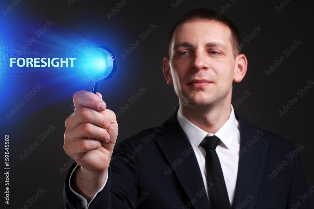 The concept of business, technology, the Internet and the network. A young entrepreneur working on a virtual screen of the future and sees the inscription: Foresight The concept of business, technology, the Internet and the network. A young entrepreneur working on a virtual screen of the future and sees the inscription: Foresight