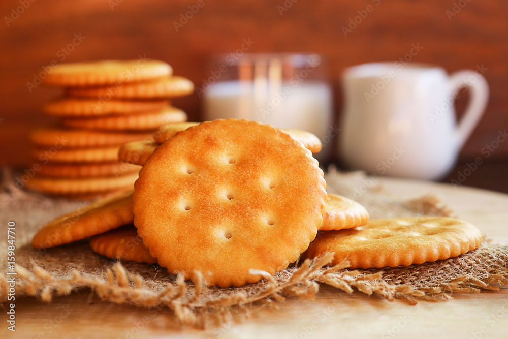 butter biscuits cracker and milk set up on wooden background