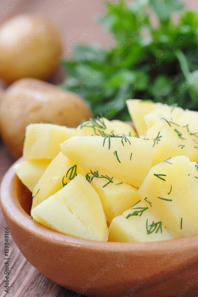 Boiled potatoes with dill and oil