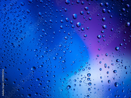 Water drops color background rain glass space rainbow.