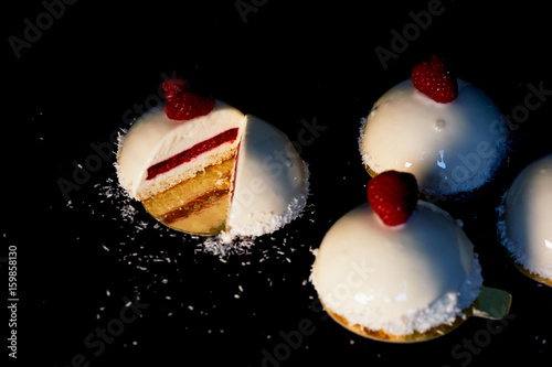 Brownie raspberry ice cream. Is massovoe cake from a mousse-cream, generovani raspberries without sugar,and the base of biscuit and cream.The mirror is decorated with icing,fresh raspberries and a photo