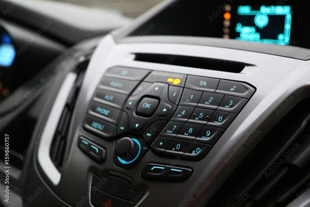 balck luxury car from inside. Close up of steering wheel, seat and circuit