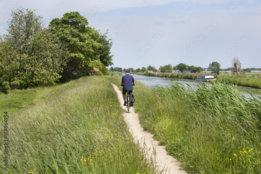 Cycling on an official bicycle path along the water