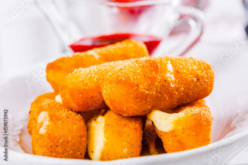 Fried cheese sticks with sauce