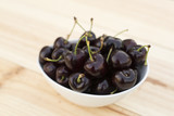 White bolw  with ripe cherries