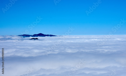 View over the clouds with tree tops in the middle – Moro Rock, Sequoia National Park, California, USA