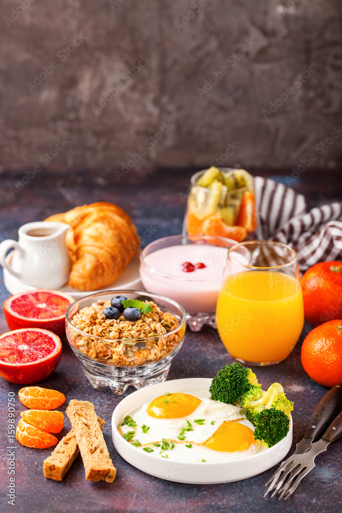 Breakfast - fried eggs with broccoli, muesli, croissant and juice on a table. Selective focus. Copy space Breakfast - fried eggs with broccoli, muesli, croissant and juice on a table. Selective focus. Copy space