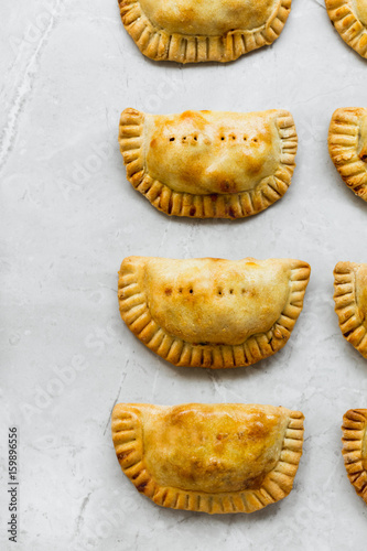 Empanadas on Grey Marble Kitchen Table