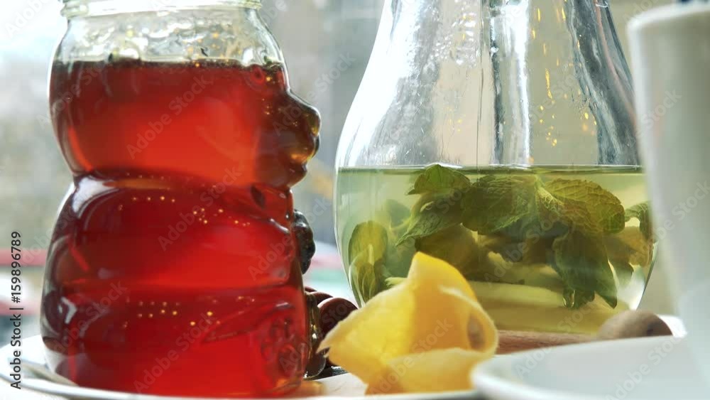 Green tea and honey on a table in a cafe closeup Stock Video Adobe