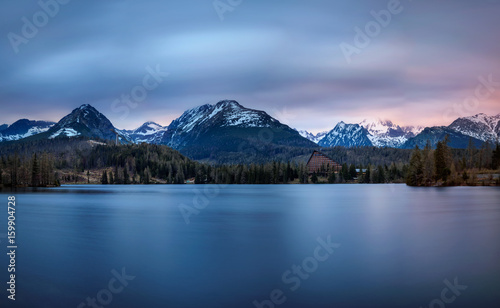 Sunset about glacial lake named Strbske Pleso in National Park High Tatras  Slovakia