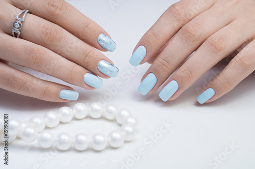 Women s hands and amazing natural nails. Ideal manicure with gel polish and nail art.
