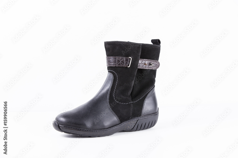 Female Black Boot on White Background, Isolated Product, Top View, Studio. Female Black Boot on White Background, Isolated Product, Top View, Studio.