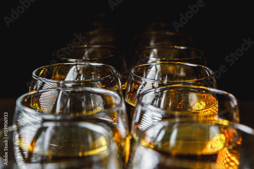 Glasses with white wine on blurred background.