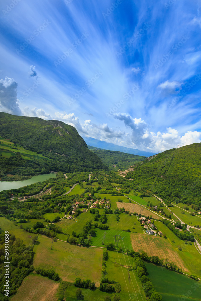 Landscape mountains, village houses. A view of the earth from the sky. Shooting with copter. France. Nature in summer