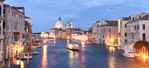 Venice panorama at night with Grand Canal and Basilica Santa Maria della Salute, Italy.