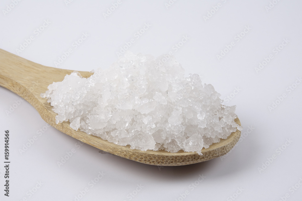 Bay Salt Sea salt in a wooden spoon. Also called bay salt or solar salt, is used ...
