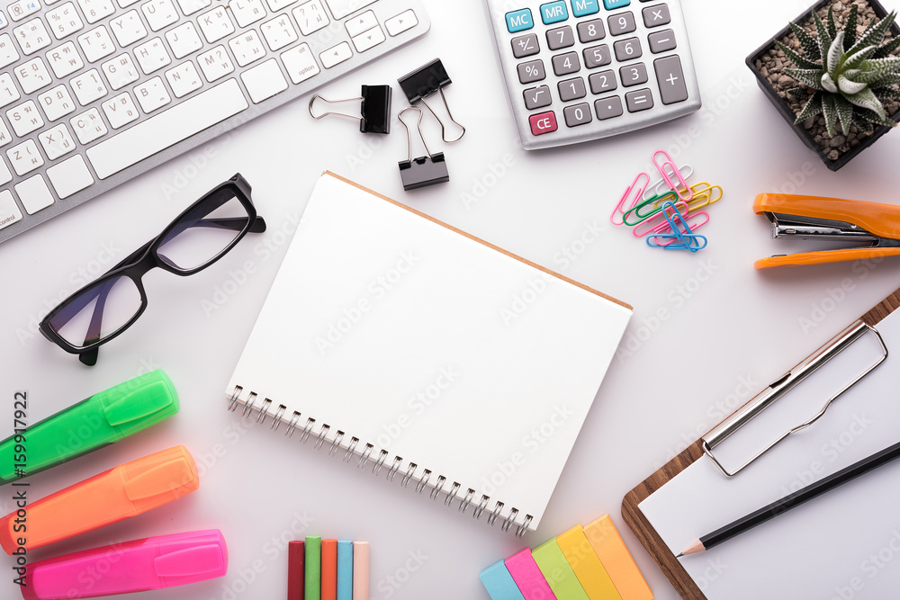 White office desk table with school accessories with office supplies. Top view with copy space White office desk table with school accessories with office supplies. Top view with copy space