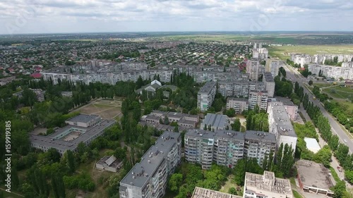 Wonderful view on Kherson city in  Ukraine from bird`s eye perspective with multistoreyed apartment blocks, green streets, spacious intersection, in a sunny day in summer. The cityscape looks great photo