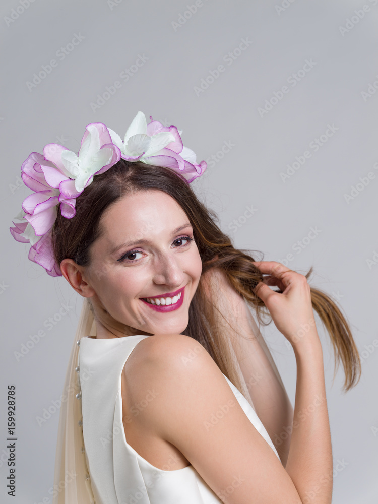 young bride in a wedding dress with a veil young bride in a wedding dress with a veil