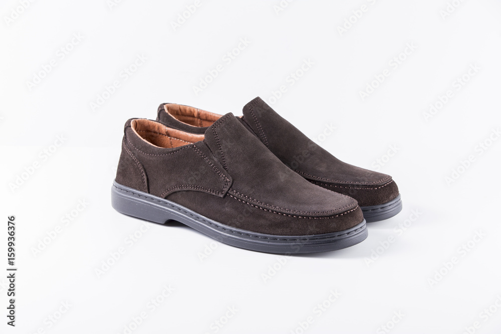 Male Brown Shoes on White Background, Isolated Product, Top View, Studio. Male Brown Shoes on White Background, Isolated Product, Top View, Studio.