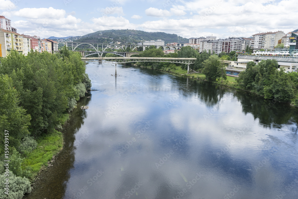 Miño river passing through Orense Roman city located in Galicia. Spain