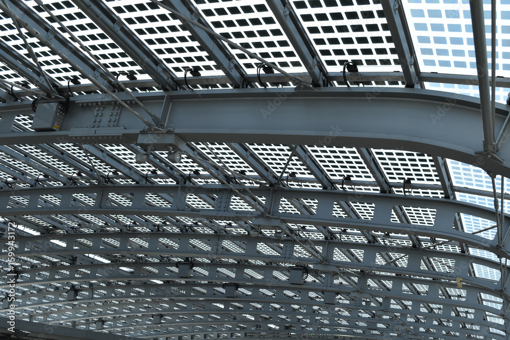 Obraz premium A modern and futuristic grey ceiling made with steel and glass; suitable to be used like background.