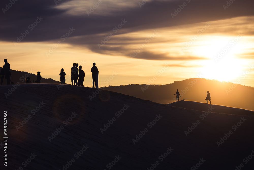 Fototapeta premium People walking on sand dunes