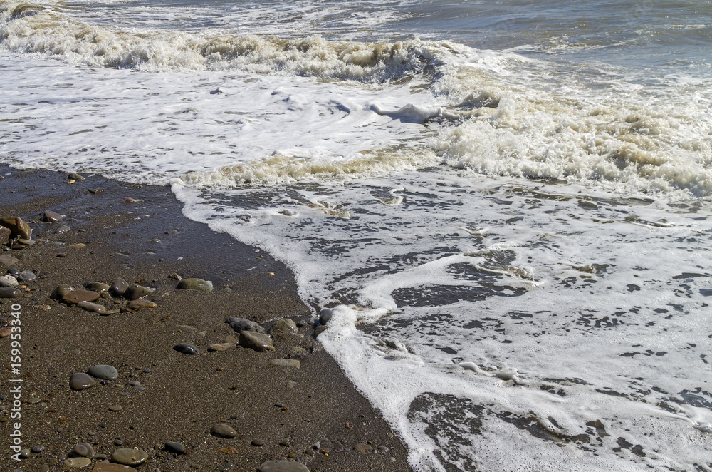 Strong surf on sandy beach. Crimea. Strong surf on sandy beach. Crimea.