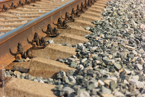 Rails and sleepers on gravel closeup