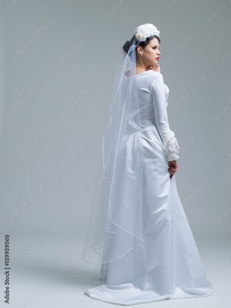 young bride in a wedding dress with a veil
