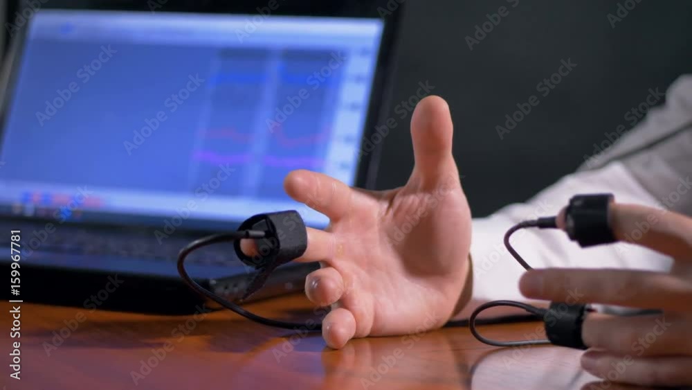 Open steady hands of lie detector subject. Open steady hands of lie detector subject.