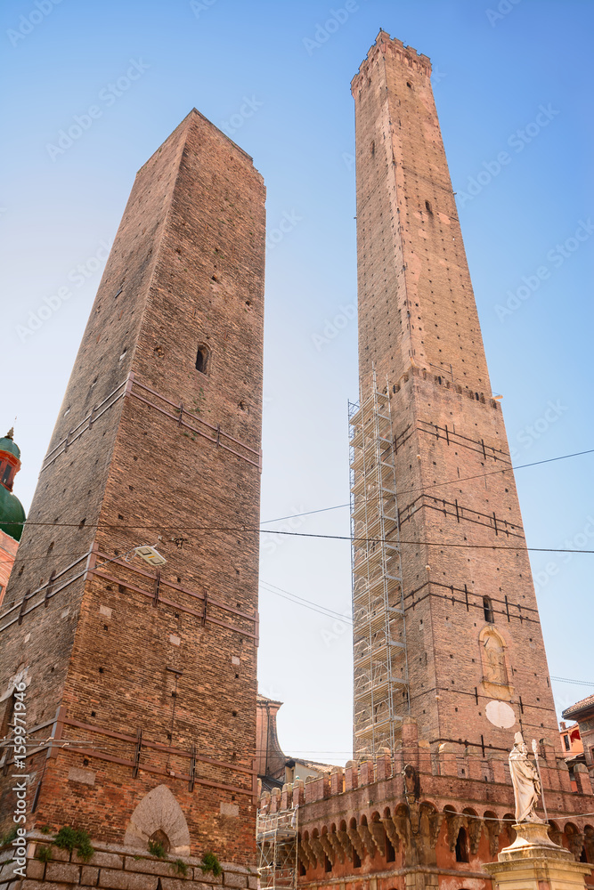 The tower of the Asinelli and Garisenda in Bologna (Italy) and the statue of San Petronio