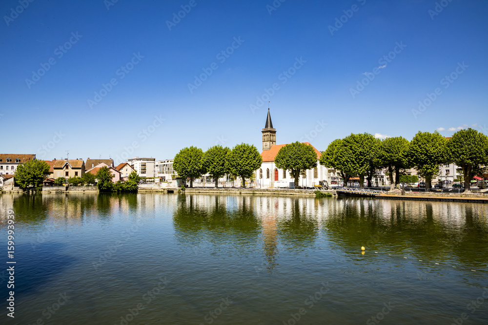 skyline of Audincourt at the river Doubs in France