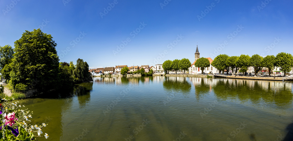 skyline of Audincourt at the river Doubs in France